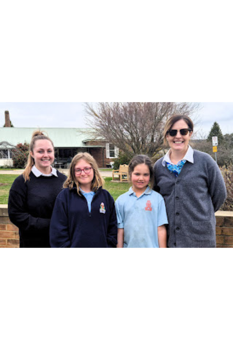 Students and learning support staff smiling together