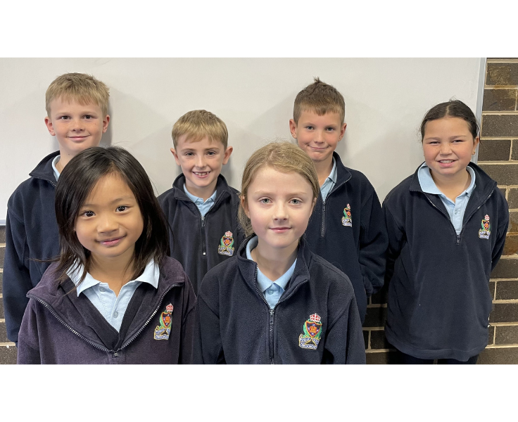 Public spearking children smiling at the camera